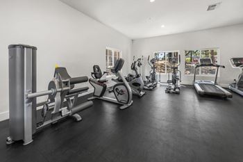 Spacious 24-hour fitness center with free weights
